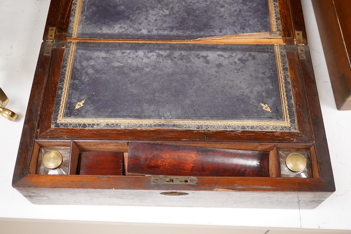A Victorian walnut rising slope together with a rosewood writing slope